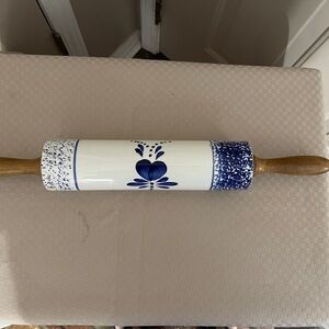 Vintage white & blue hand painted ceramic rolling pin with wood handles.